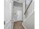 Bright entryway features hardwood floors, a high ceiling, a coat closet and a staircase at 3055 Nantuckett Ave, North Charleston, SC 29420