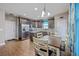 Eat-in kitchen features stainless steel appliances, tile backsplash, island, and plenty of cabinet space at 3055 Nantuckett Ave, North Charleston, SC 29420