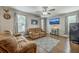 Comfortable living room features hardwood floors, a ceiling fan, and two reclining sofas at 3055 Nantuckett Ave, North Charleston, SC 29420