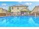 The above ground swimming pool is surrounded by a wooden fence with backyard access at 3055 Nantuckett Ave, North Charleston, SC 29420