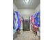 Walk-in closet featuring clothing racks on either side and a small chest of drawers at 3055 Nantuckett Ave, North Charleston, SC 29420