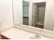 Bathroom with a sink and a closet and shower visible in the mirror at 311 Dupont Way, Summerville, SC 29485
