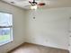 Bedroom featuring neutral carpeting, a ceiling fan and a large window providing natural light at 311 Dupont Way, Summerville, SC 29485