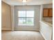 Bright room with neutral carpet, gray walls and a view of the outdoors through a window at 311 Dupont Way, Summerville, SC 29485