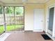 Covered screened porch featuring a ceiling fan and access to the backyard at 311 Dupont Way, Summerville, SC 29485