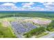 Wide aerial view of campus with sports fields, tennis courts, and parking amidst green spaces at 315 Clubview Rd, Summerville, SC 29485