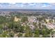 High aerial view of home surrounded by trees, adjacent to a golf course, and in a suburban neighborhood at 315 Clubview Rd, Summerville, SC 29485