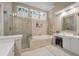 The bathroom features a vanity, walk-in shower, garden tub, and plantation shutters at 315 Clubview Rd, Summerville, SC 29485