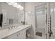 Bright bathroom featuring a white vanity with marble countertop and a shower-tub combo at 315 Clubview Rd, Summerville, SC 29485
