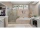 The bathroom features a vanity, walk-in shower, garden tub, and plantation shutters at 315 Clubview Rd, Summerville, SC 29485