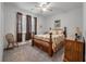 Bedroom featuring a decorative wood bedframe, dresser, ceiling fan, and carpeted flooring at 315 Clubview Rd, Summerville, SC 29485