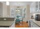 Cozy breakfast nook features a bay window, hardwood floors, and modern chandelier at 315 Clubview Rd, Summerville, SC 29485