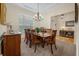 Formal dining room featuring wood furnishings, decorative chandelier, and natural light at 315 Clubview Rd, Summerville, SC 29485