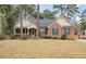 Charming brick home with green shutters and a well-manicured front yard at 315 Clubview Rd, Summerville, SC 29485