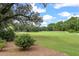 A wide view of a lush green golf course with mature trees and manicured landscaping at 315 Clubview Rd, Summerville, SC 29485