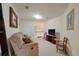 Living area with carpeting, a recliner, television, and door to an adjacent room at 315 Clubview Rd, Summerville, SC 29485