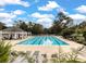 The community pool featuring a bathhouse, clear water, a well-maintained pool deck, and mature landscaping at 315 Clubview Rd, Summerville, SC 29485