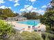 An inviting community pool featuring clean design, surrounding flora, and comfortable lounge seating at 315 Clubview Rd, Summerville, SC 29485