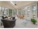 Inviting sunroom with ample windows, a ceiling fan, and comfortable seating at 315 Clubview Rd, Summerville, SC 29485