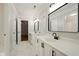 Elegant bathroom with double sinks, black hardware and modern marble floors at 317 Sabal Palmetto Ct, Moncks Corner, SC 29461