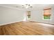 Spacious bedroom with hardwood floors, neutral walls and two bright windows at 317 Sabal Palmetto Ct, Moncks Corner, SC 29461