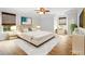 Inviting bedroom with a ceiling fan, natural light and simple modern decor at 317 Sabal Palmetto Ct, Moncks Corner, SC 29461