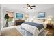 Serene bedroom with large windows, neutral walls and stylish decor at 317 Sabal Palmetto Ct, Moncks Corner, SC 29461