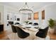 Dining room with chandelier over the table and chairs at 317 Sabal Palmetto Ct, Moncks Corner, SC 29461