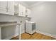 Laundry room featuring storage cabinets, granite countertop and washer at 317 Sabal Palmetto Ct, Moncks Corner, SC 29461