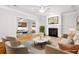 Bright living room with a fireplace, neutral furniture, and hardwood floors at 317 Sabal Palmetto Ct, Moncks Corner, SC 29461