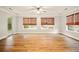 Empty living room with hardwood floors, neutral paint, and lots of natural light at 317 Sabal Palmetto Ct, Moncks Corner, SC 29461