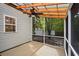 Relaxing screened porch has a ceiling fan and views of backyard trees at 317 Sabal Palmetto Ct, Moncks Corner, SC 29461