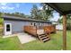 Backyard showcasing a wooden deck and well-maintained backyard at 323 Amy Dr, Goose Creek, SC 29445
