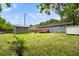 Spacious backyard featuring a shed and partial wooden deck, perfect for outdoor entertaining at 323 Amy Dr, Goose Creek, SC 29445