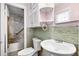 Well-lit bathroom with tile accents, built-in shelves and shower and bath combination at 323 Amy Dr, Goose Creek, SC 29445