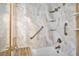 Updated marble tile shower and tub combination with bench and modern fixtures at 323 Amy Dr, Goose Creek, SC 29445