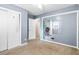 Bedroom featuring neutral walls, plush carpet, closet, and ceiling fan at 323 Amy Dr, Goose Creek, SC 29445