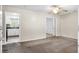 Neutral living room featuring neutral walls, ceiling fan, and doorway to the kitchen at 323 Amy Dr, Goose Creek, SC 29445