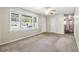 Neutral living area featuring vinyl flooring, large windows and ceiling fan at 323 Amy Dr, Goose Creek, SC 29445