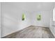 Freshly painted shed interior with light colored hardwood flooring and plenty of natural light at 323 Amy Dr, Goose Creek, SC 29445
