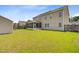 Lush backyard featuring a screen porch and a storage shed at 334 Cicadas Song Dr, Moncks Corner, SC 29461