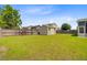 Expansive backyard with lush grass and a charming storage shed at 334 Cicadas Song Dr, Moncks Corner, SC 29461