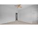 Bedroom featuring a ceiling fan, neutral carpet, white walls, and convenient access to other rooms of the home at 334 Cicadas Song Dr, Moncks Corner, SC 29461