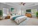Light-filled bedroom featuring a bed, a dresser, and large windows at 334 Cicadas Song Dr, Moncks Corner, SC 29461