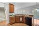 Corner kitchen view with granite countertops, stainless steel sink, dark cabinets, and hardwood floors at 334 Cicadas Song Dr, Moncks Corner, SC 29461