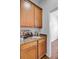Butler's pantry features cabinets, granite countertop, and space for wine storage at 334 Cicadas Song Dr, Moncks Corner, SC 29461