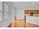 Bright breakfast nook with hardwood floors, bar seating, and access to the home's sliding glass door at 334 Cicadas Song Dr, Moncks Corner, SC 29461