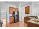 Bright kitchen features wood floors, granite countertops, and stainless steel appliances, with ample cabinet storage at 334 Cicadas Song Dr, Moncks Corner, SC 29461