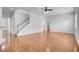 Open living area with hardwood floors, natural light, staircase, and neutral wall color at 334 Cicadas Song Dr, Moncks Corner, SC 29461