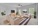 Inviting living room with modern furniture, stylish rug, and a ceiling fan at 334 Cicadas Song Dr, Moncks Corner, SC 29461